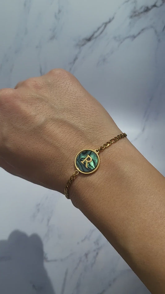 Gold plated cuban chain bracelet with initial letter.