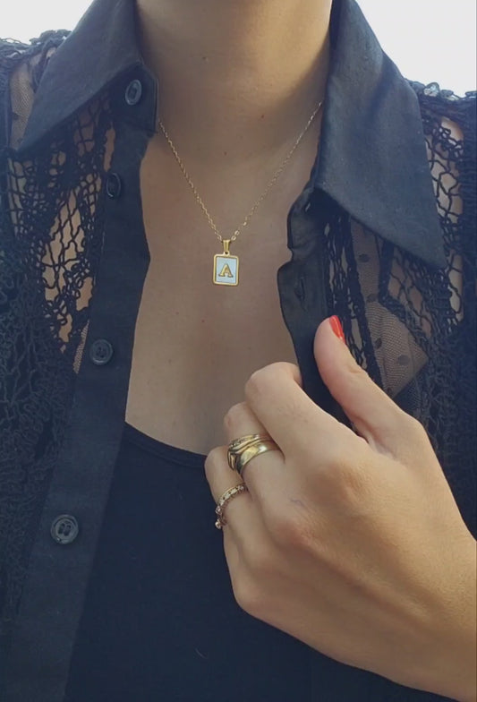 18k gold plated white shell letter pendant necklace.